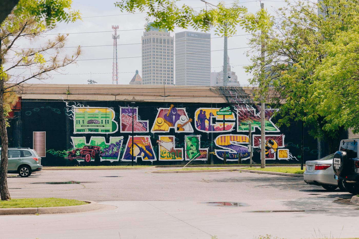 Black Wall Street mural with Tulsa skyline